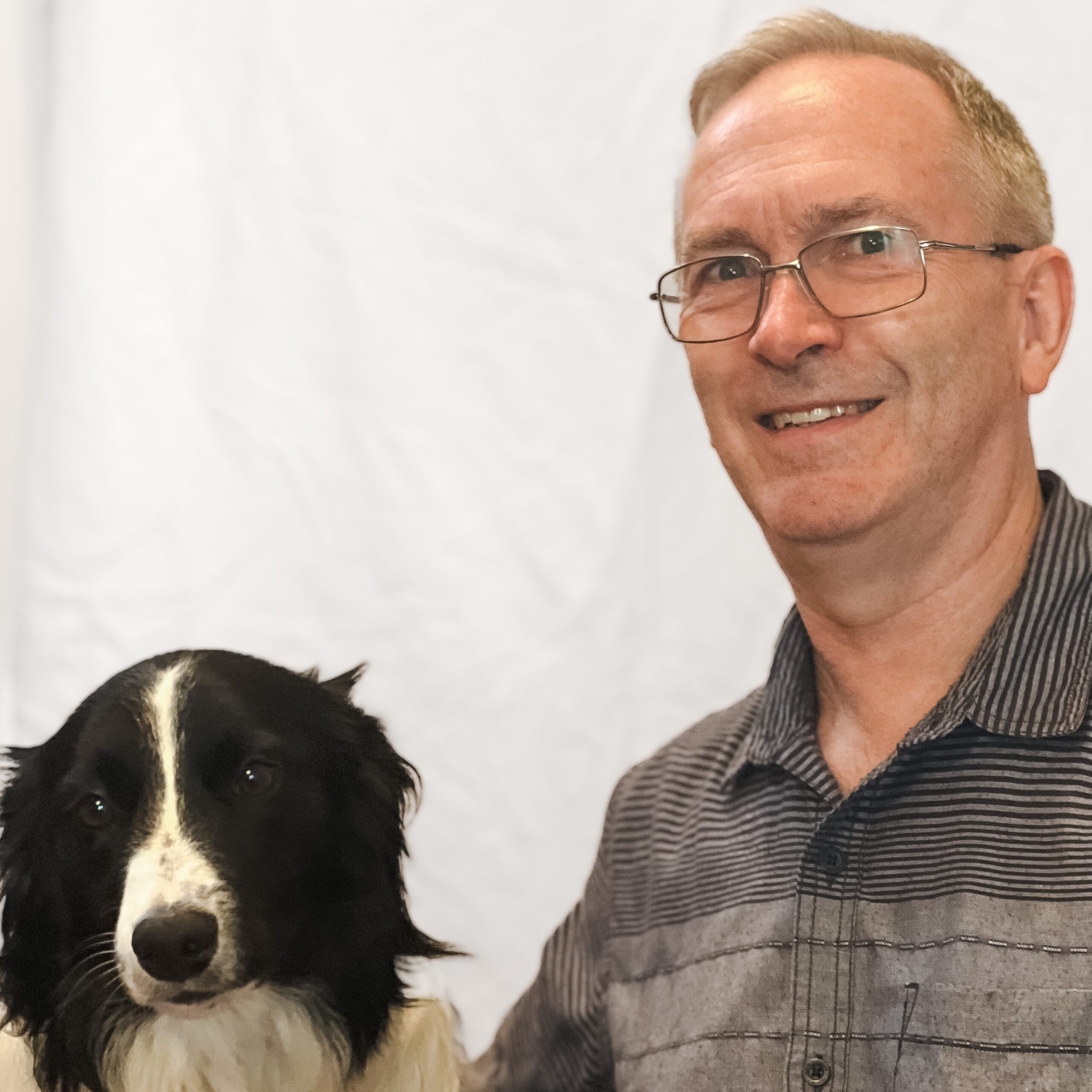 John Scarlett and his black and white dog Kaos